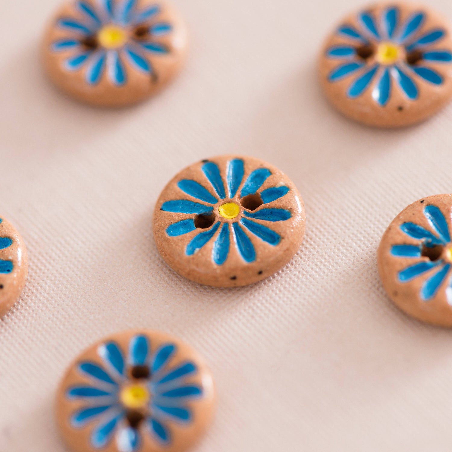 Quince & Co. - Bright blue daisy buttons