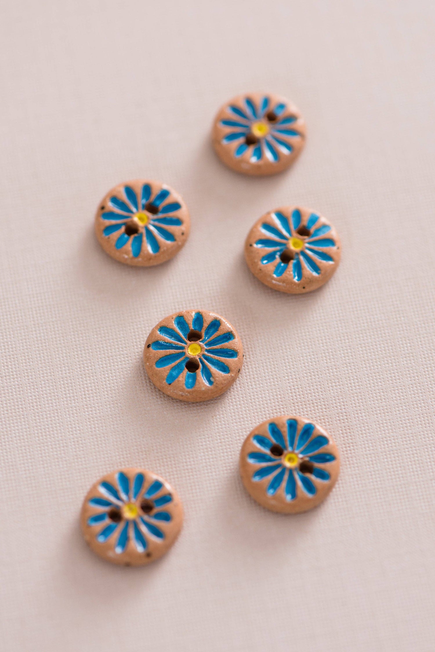 Quince & Co. - Bright blue daisy buttons