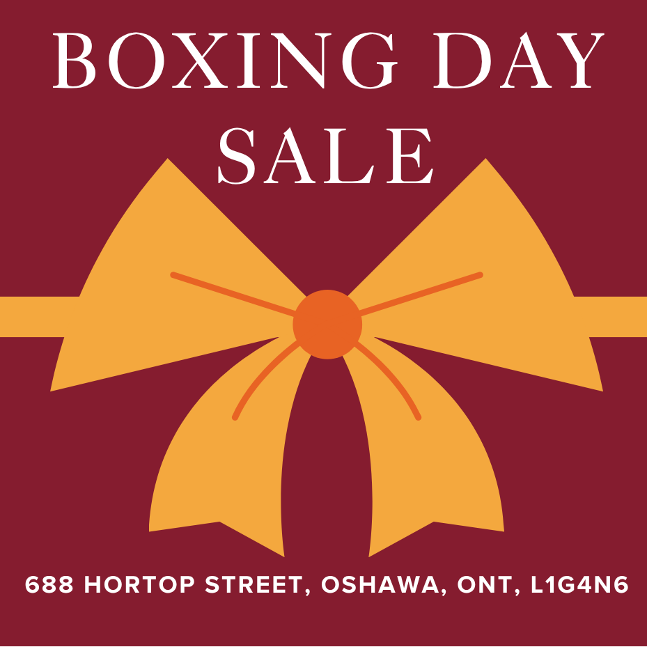 Promotional poster for Boxing Day sale with a large yellow bow on a red background.